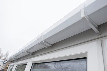 A picture of a gutter and soffit board after it has been professionally cleaned.  