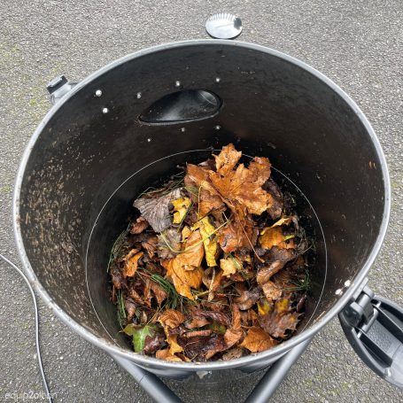 Our gutter vacuum systems bucket full of debris from a clients gutter that has been cleaned
